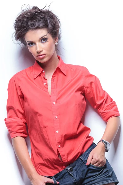 Serious young woman with hands in pockets — Stock Photo, Image