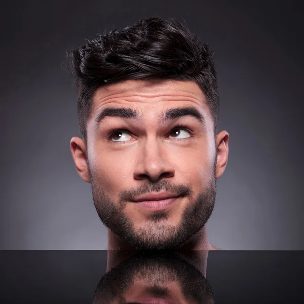 Head of young man looking to his side — Stock Photo, Image