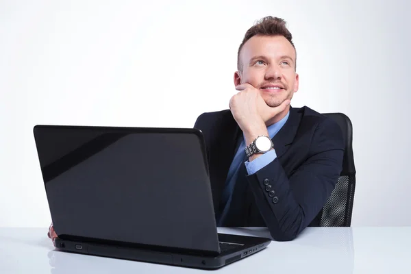 Business man daydreaming at his laptop — Stock Photo, Image