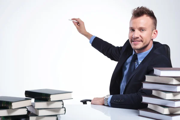 Business man writes with chalk — Stock Photo, Image