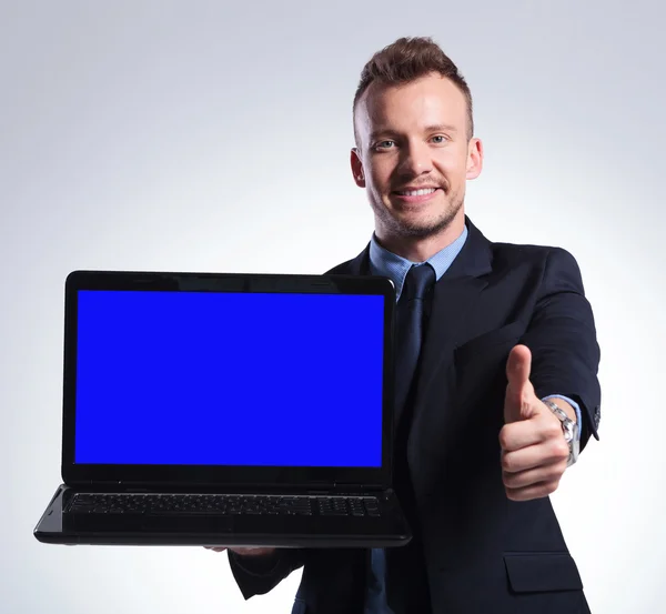 Business man recommends you his laptop — Stock Photo, Image