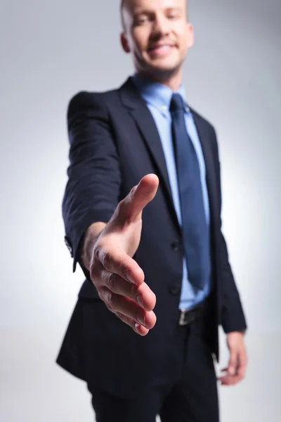 Business man offers handshake — Stock Photo, Image