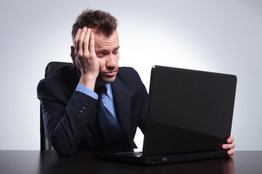 business man falls asleep at laptop