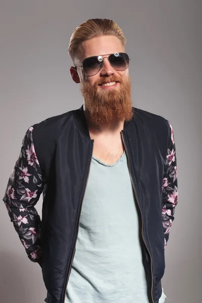 Bearded young man smiles at you — Stock Photo, Image