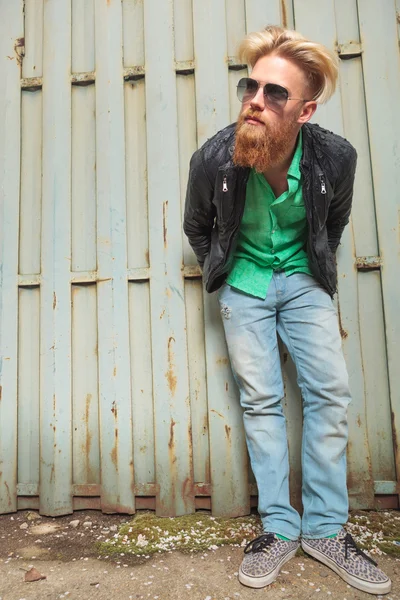 Young bearded man bends forward — Stock Photo, Image