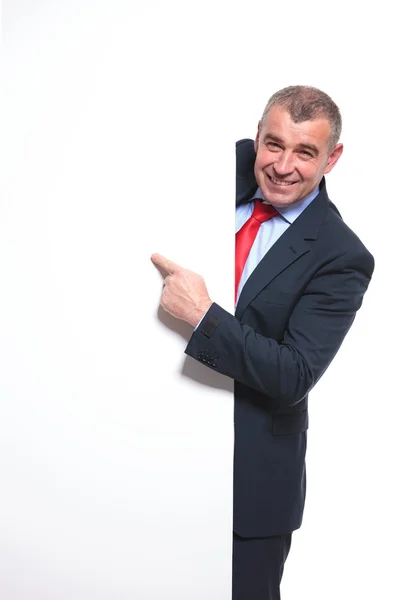 Business man indicating on panel — Stock Photo, Image