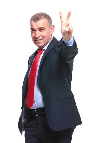 Business man shows victory sign — Stock Photo, Image