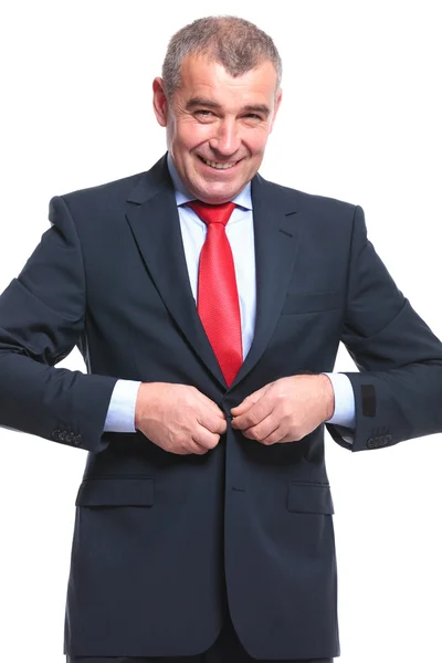 Business man buttoning his jacket — Stock Photo, Image