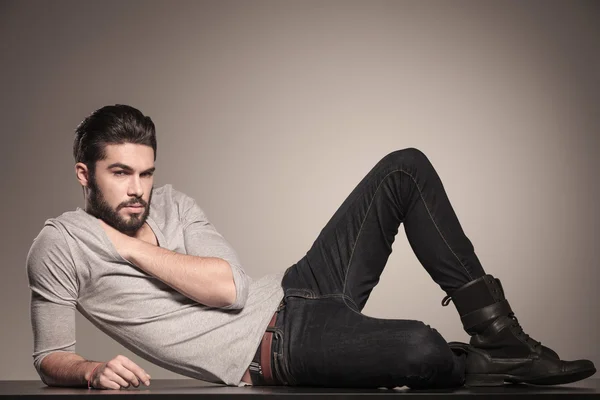 Young man resting on the floor — Stock Photo, Image