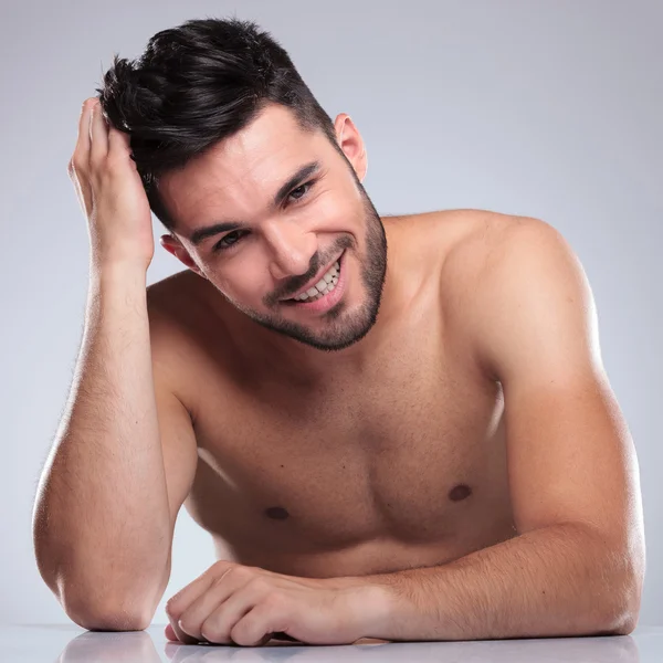 Young laughing man is posing for the camera — Stock Photo, Image