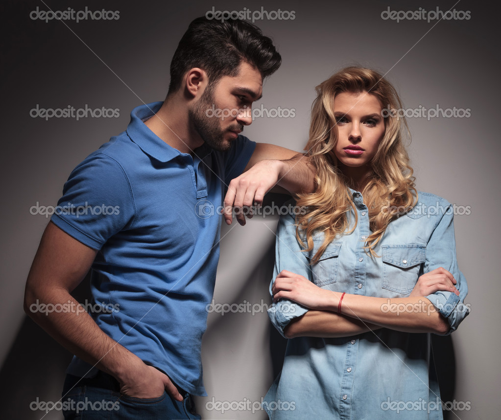 young casual man looking at his girlfriend