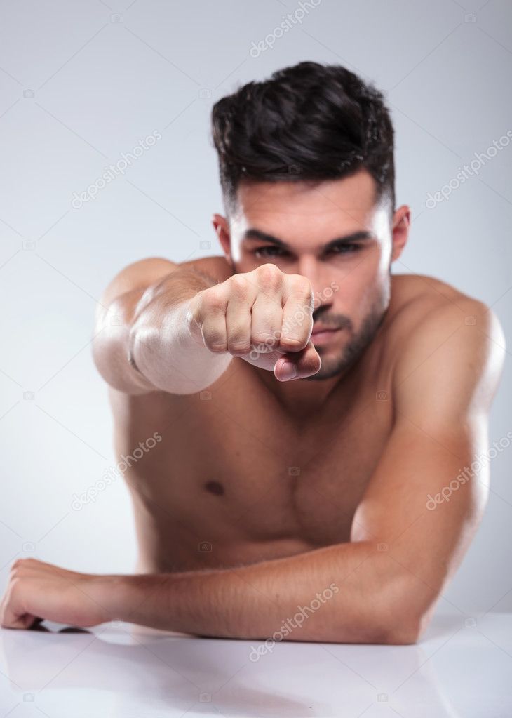naked man throwing a punch