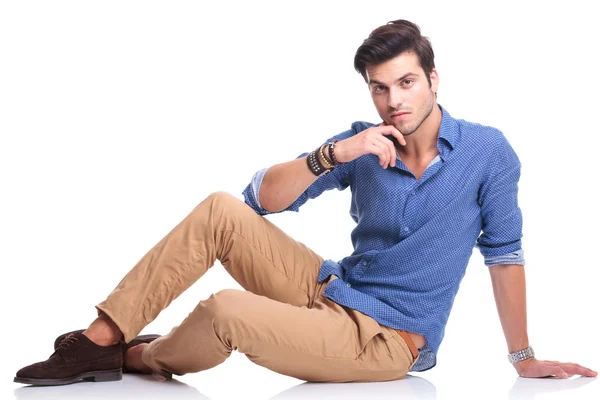Young casual man looking pensive — Stock Photo, Image