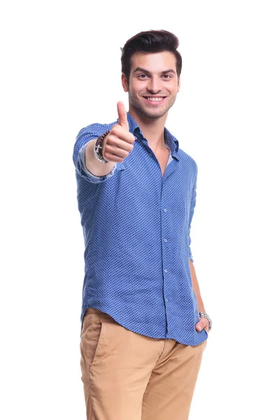 Casual man making the ok thumbs up hand sign — Stock Photo, Image