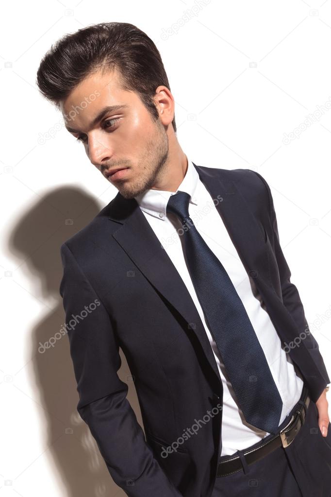 Side view of a fashion businessman with hands in pockets