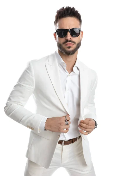 Handsome Businessman Arranging His Suit Wearing Sunglasses Posing White Background — Stock Photo, Image