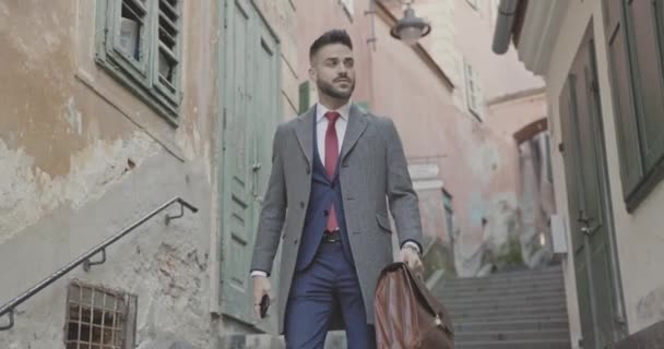 Handsome Fashion Model Walking Stairs Looking Side Holding His Briefcase — Stock Video