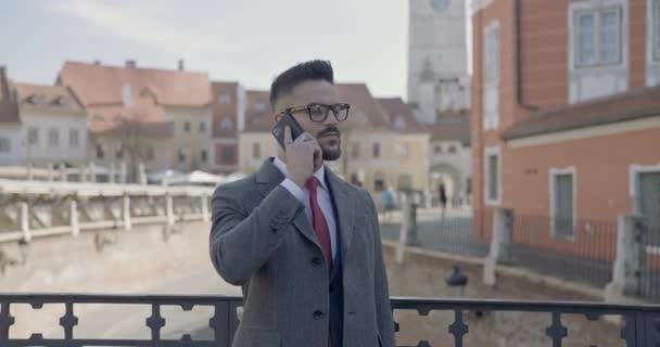 Attractive Young Businessman Suit Long Coat Glasses Talking Phone Looking — Stock Video