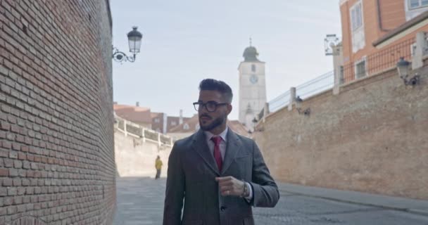 Attractive Businessman Fixing His Tie Looking Wearing Eyeglasses Outdoor — Stock Video