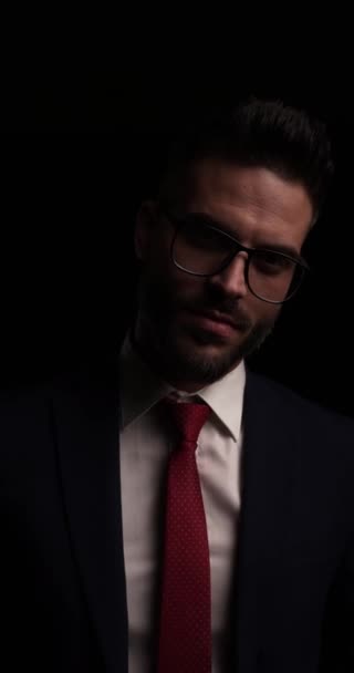 Vertical Video Dramatic Man Suit Adjusting Jacket Glasses Fading Walking — Stock Video