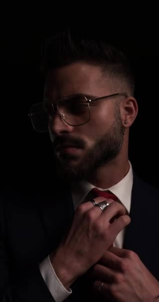Handsome Unshaved Businessman Metal Frame Glasses Looking Side Fixing Tie — Stock Video