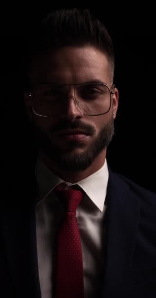 Vertical Video Bearded Young Guy Arranging Fixing Metal Frame Glasses — Stock Video