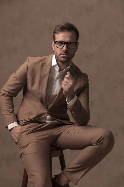 Seated Businessman Wearing Eyeglasses Holding One Hand Pocket Fashion Pose — Fotografia de Stock