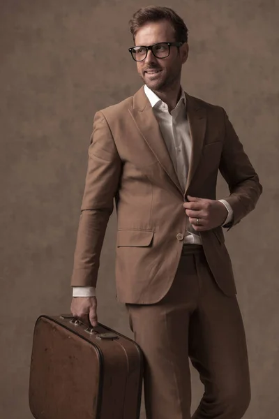 Handsome Young Businessman Fixing His Suit Smiling Holding Briefcase Brown — Fotografia de Stock