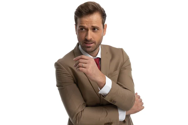 Sexy Businessman Folding His Arms Looking Away Posing White Background — Stock fotografie