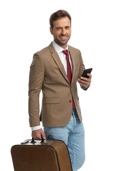 Young Handsome Businessman Texting His Phone Holding Briefcase White Background — Stok fotoğraf