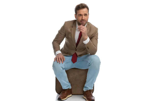 Handsome Businessman Scratching His Chin Looking Away Resting Chair White — Stok fotoğraf