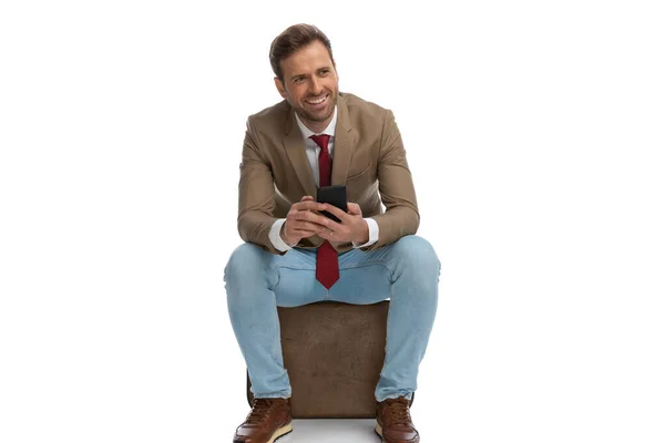 Young Businessman Texting His Phone Smiling Sitting White Background — Stock Fotó
