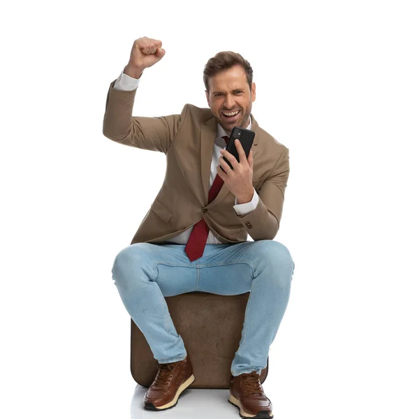 Seated Businessman Sending His Excitement Phone Celebrating Success — 스톡 사진