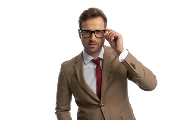 Sexy Businessman Fixing His Eyeglasses Firm Grip Looking Camera White — Stockfoto