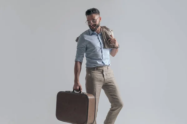 Enthusiastic Businessman Eyeglasses Jacket Shoulder Holding Suitcase Looking Smiling While — Stock Photo, Image