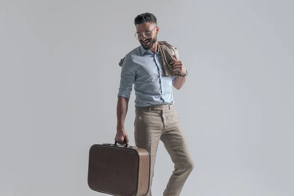 Enthusiastic Businessman Eyeglasses Jacket Shoulder Holding Suitcase Looking Smiling While — Stockfoto