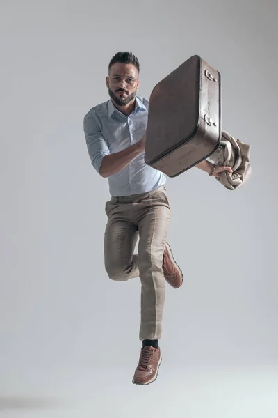 Dynamic Young Businessman Holding Bag Jacket While Jumping Air Grey —  Fotos de Stock