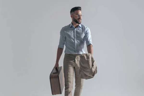 Sexy Young Man Holding Jacket Suitcase Looking Side While Walking — Fotografia de Stock