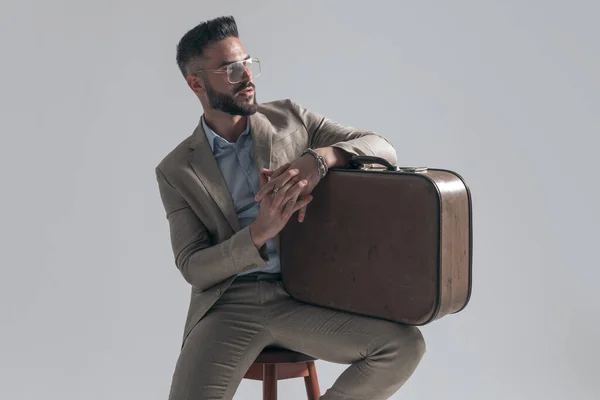 Bearded Young Businessman Holding Arms Bag Looking Side While Sitting — Photo