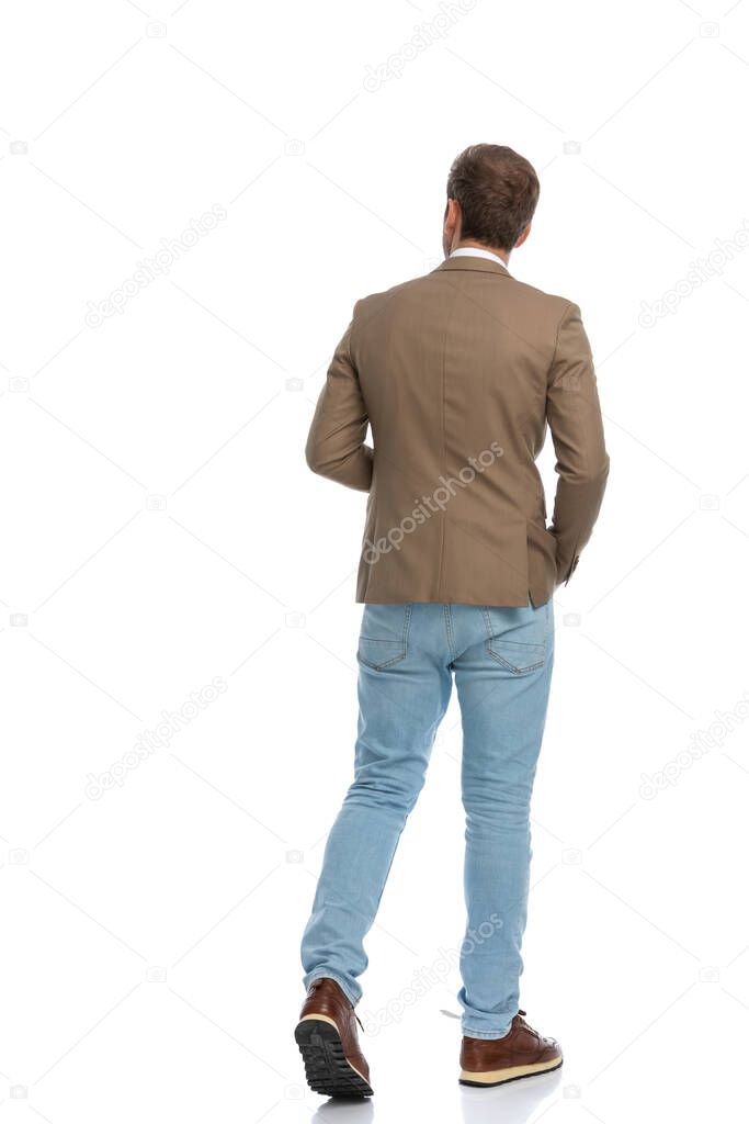 rear view of a businessman walking on his path and exploring the place on white background