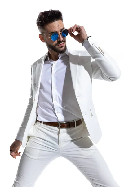 Bearded Businessman Looking Side Fixing Retro Sunglasses White Background Studio — Stock Photo, Image