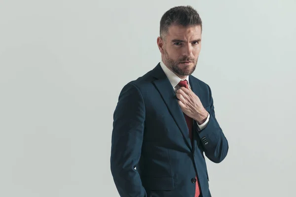 Side View Attractive Man Suit Hand Pocket Fixing Red Tie — Stock Photo, Image