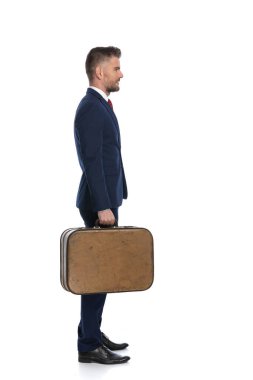 Bir iş adamının yan görüntüsü. Tatil için sırasının gelmesini bekliyor. 