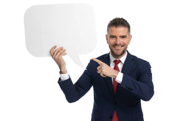 Young Businessman Pointing Speech Bubble Holding Smiling Camera — Stock Photo, Image