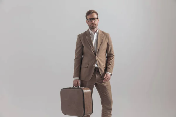 Fashion Picture Handsome Businessman Posing Suitcase Relaxed Posture Gray Background — Stock Photo, Image