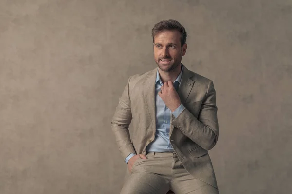 Cool Seated Businessman Fixing His Collar Holding Hand Pocket Looking — Stock Photo, Image