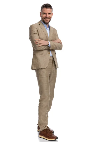 Unshaved Middle Aged Man Beige Suit Smiling Crossing Arms White — Stockfoto