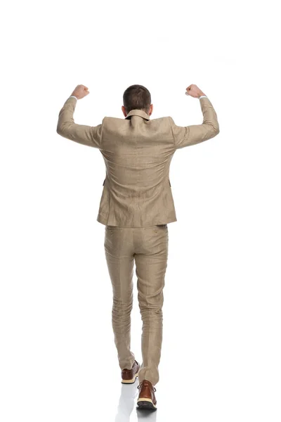 Back View Businessman Beige Suit Holding Arms Air Walking While — Foto de Stock