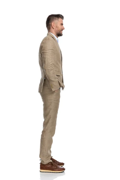 Middle Aged Businessman Beige Suit Standing Line Hands Pockets White — Zdjęcie stockowe