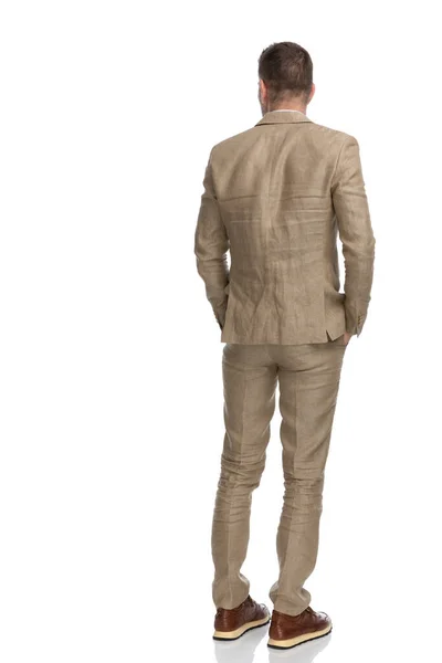 Back View Grizzled Hair Man Beige Suit Holding Hands Pockets — Stok fotoğraf